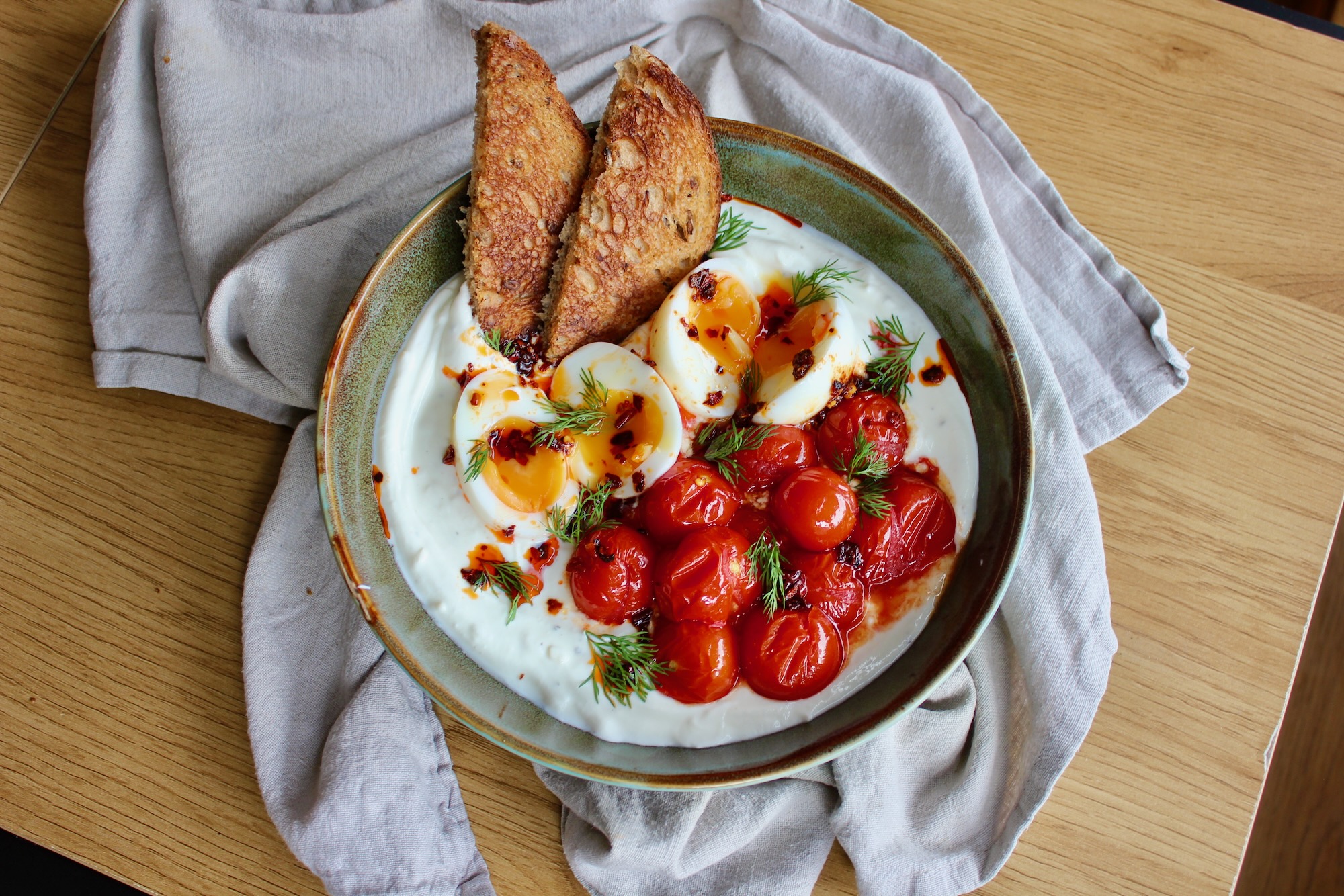 Turkish eggs with slow roasted cherry tomatoes